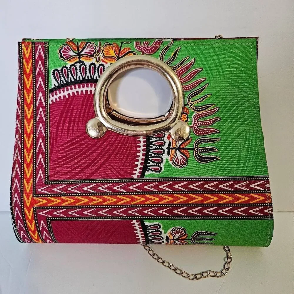 P.K Garments bright green and pink bag with gold hardware.